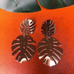 Gold tropical leaf statement earrings